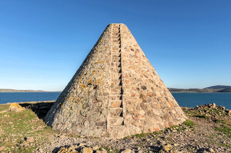 Stone pyramid monument on the Lemnos coast - Historical guarding spot, offering panoramic views of the surrounding sea and landscape.