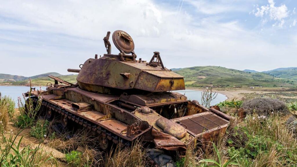 An abandoned tank resting on a hilltop overlooking the coastline in Lemnos, a remnant of the past.