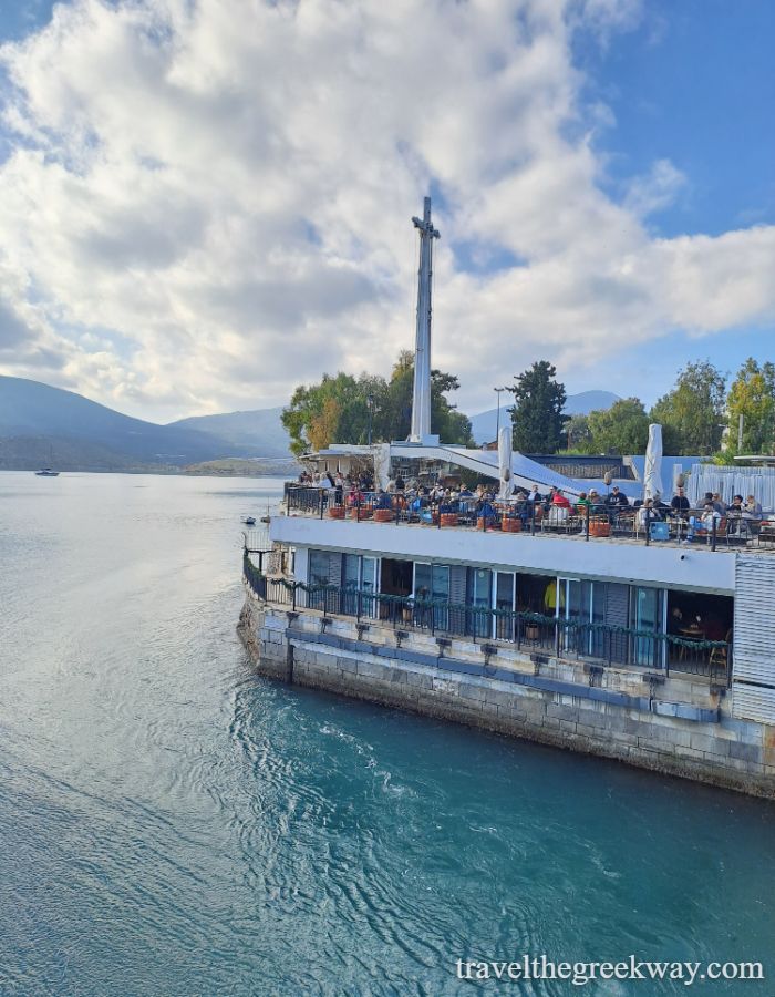Best Things to Do in Chalkida: Seafront café in Chalkida, Greece, built over the water with outdoor seating and people enjoying the view
