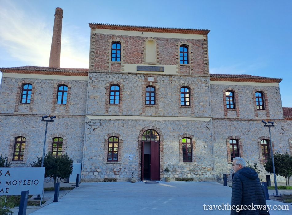 Front view of the Arethousa Archaeological Museum in Chalkida, housed in a restored 20th-century stone distillery building.