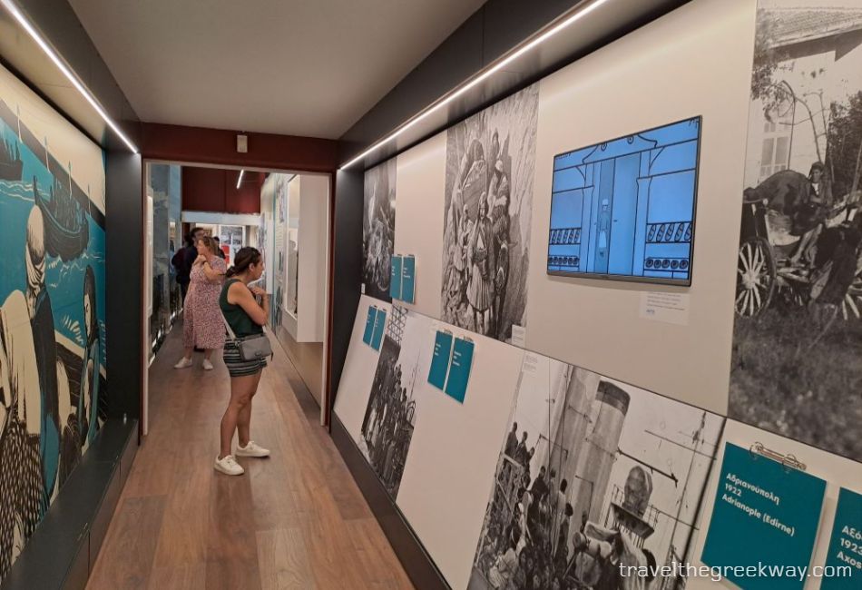Exhibition hall with photos and interactive displays at the National Historical Museum of Athens.