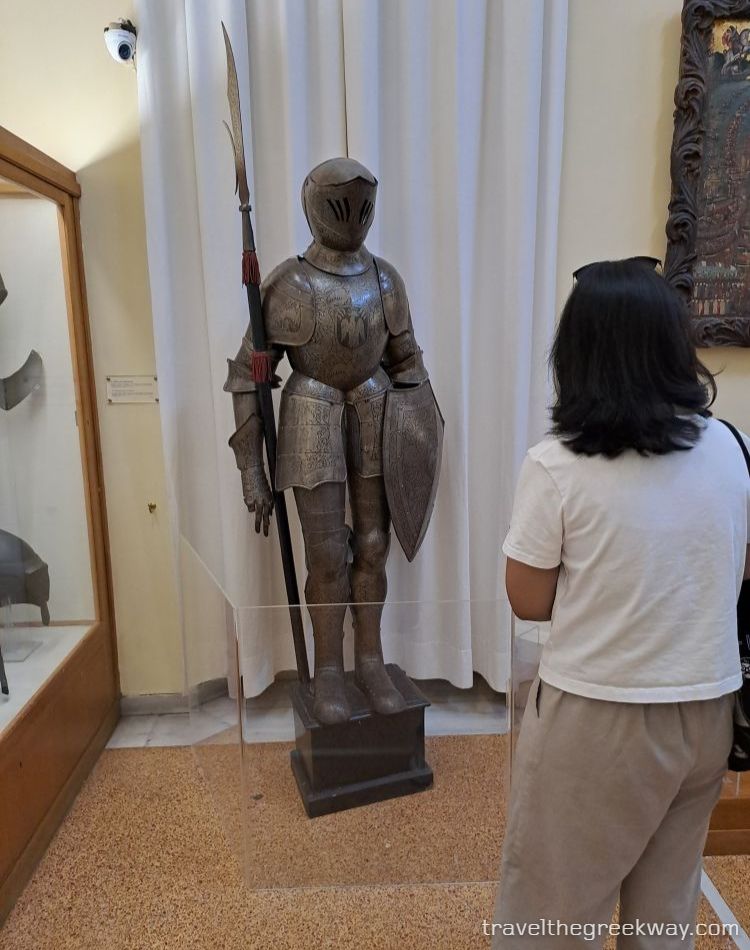 Full suit of medieval armor with spear and shield at the National Historical Museum of Athens.