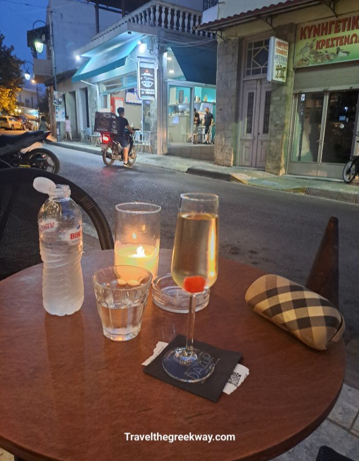 Evening drinks with candlelight at a bar in Krestena village.