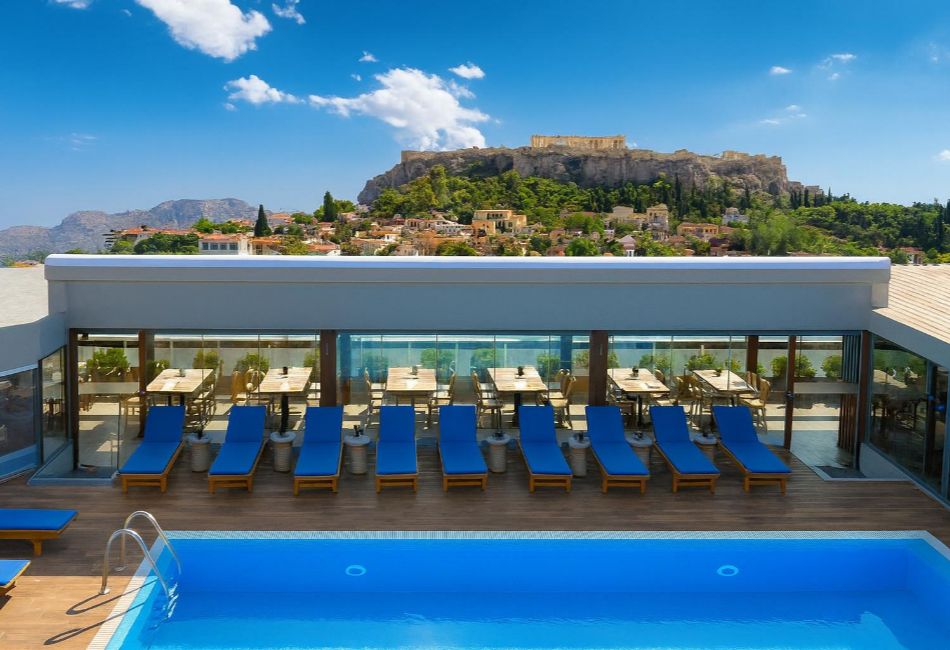 Wyndham Athens rooftop pool with Acropolis and city skyline views.