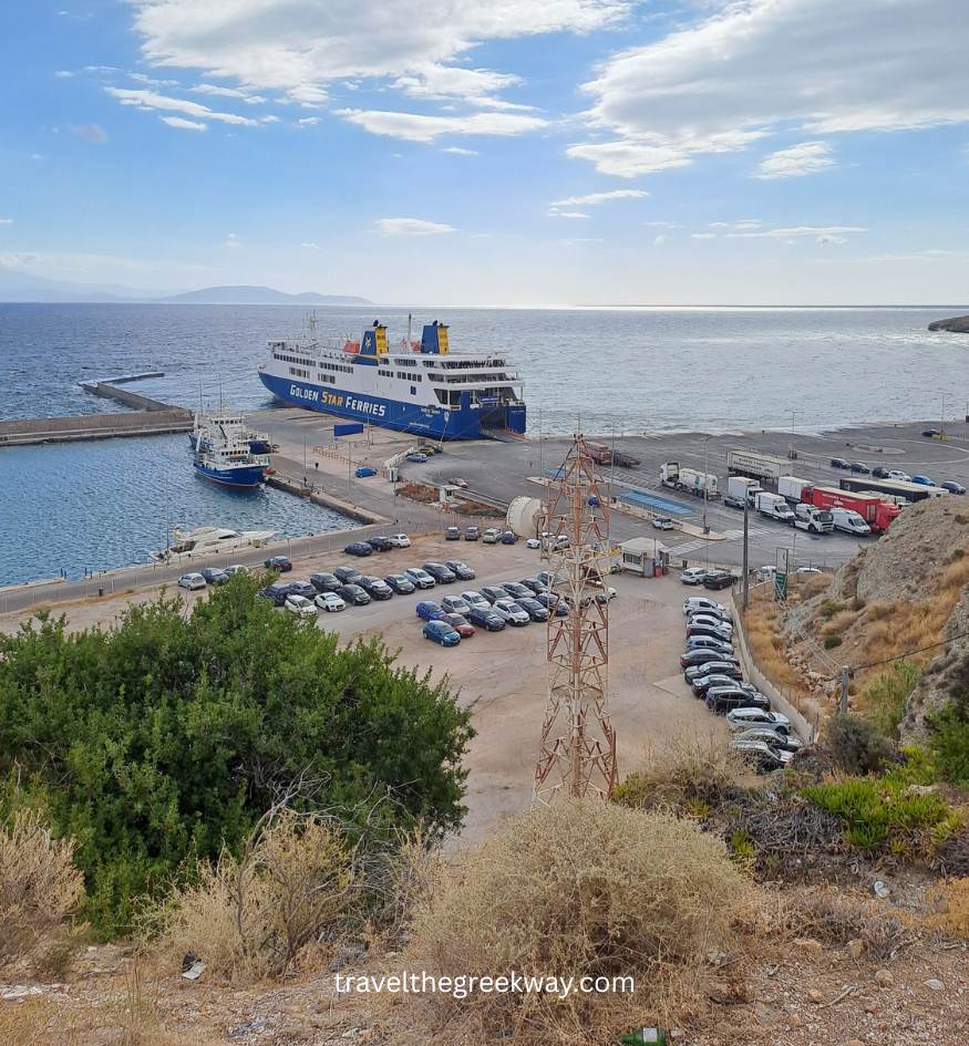 Rafina port in Athens with ferry docked, cars parked, and open sea view under a partly cloudy sky.