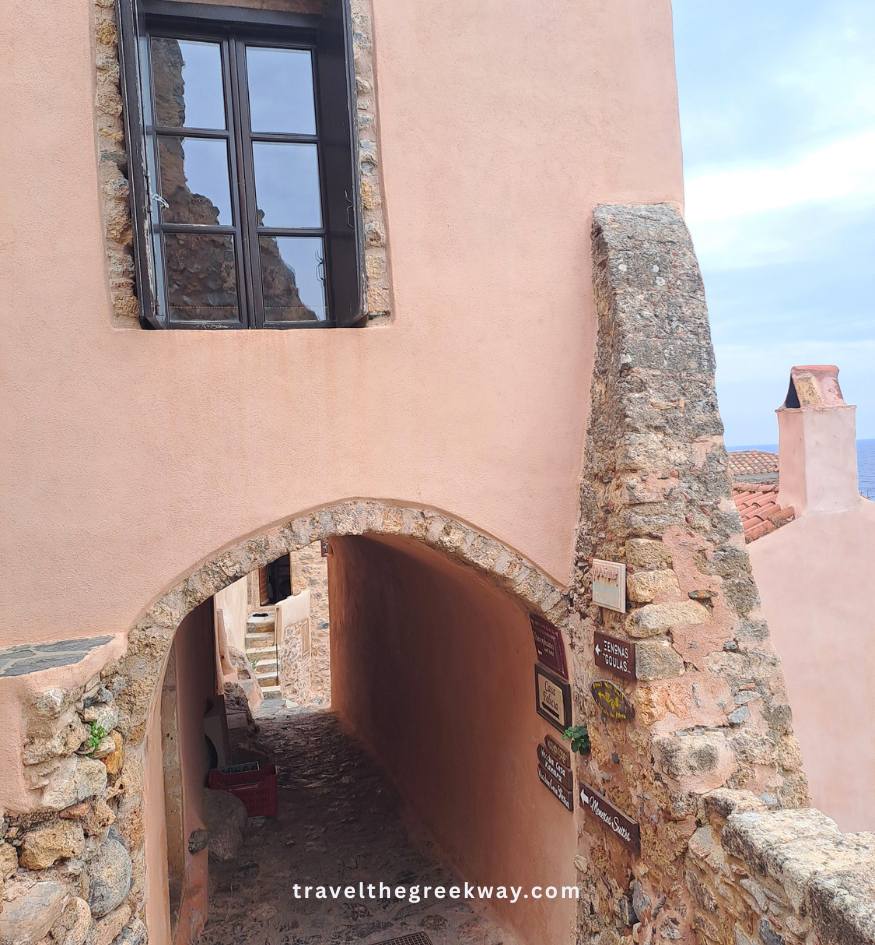 A narrow stone archway and hidden alley path inside Monemvasia, Peloponnese Greece.