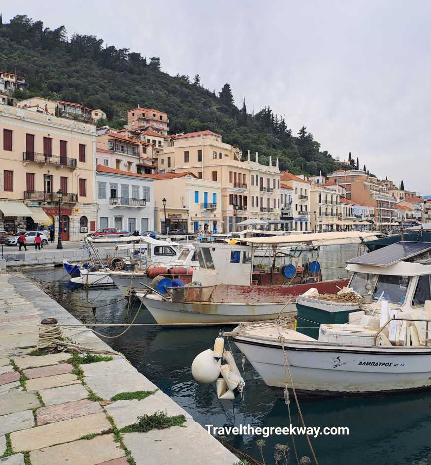 Traditional fishing boats moored along the scenic waterfront of Gythio, Peloponnese Greece.
