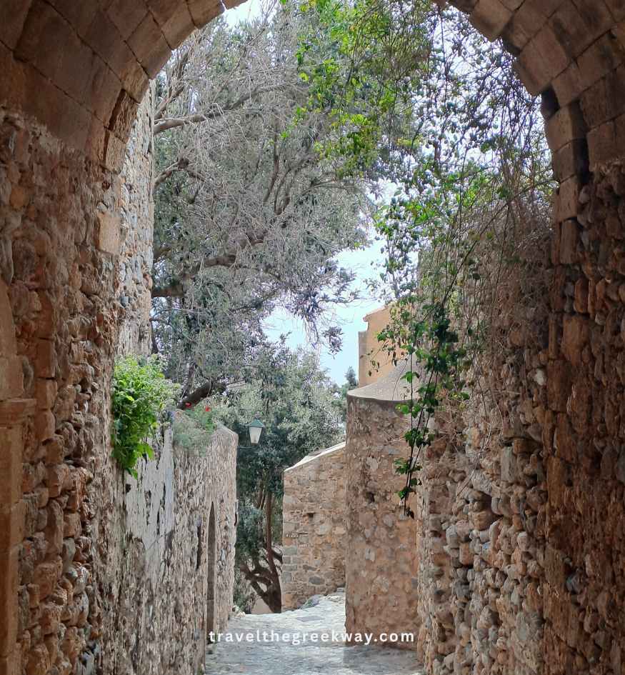 A beautiful vaulted stone archway looking over narrow alleys in Monemvasia, Peloponnese Greece.