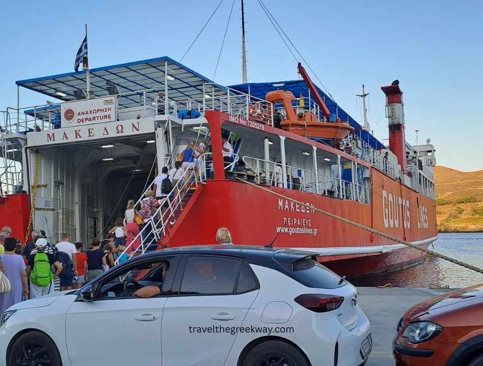Passengers and vehicles boarding the ferry at the port of Korissia on Kea island for the return journey to mainland Greece.